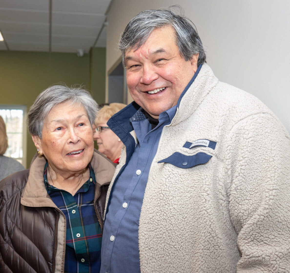 Two members of Penobscot Indian Nation at a gathering to celebrate the grand opening of the new Penobscot Elder Homes in Indian Island, Maine.
