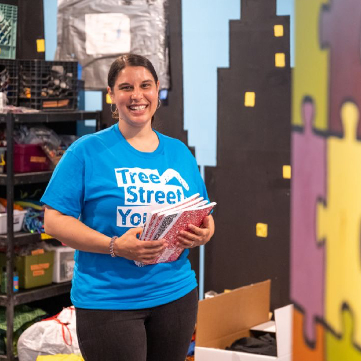 Julia Sleeper-Whiting, Executive Director of Tree Street Youth, stands in a classroom in the building she was able to purchase with the help of financing and guidance from the Genesis Fund.