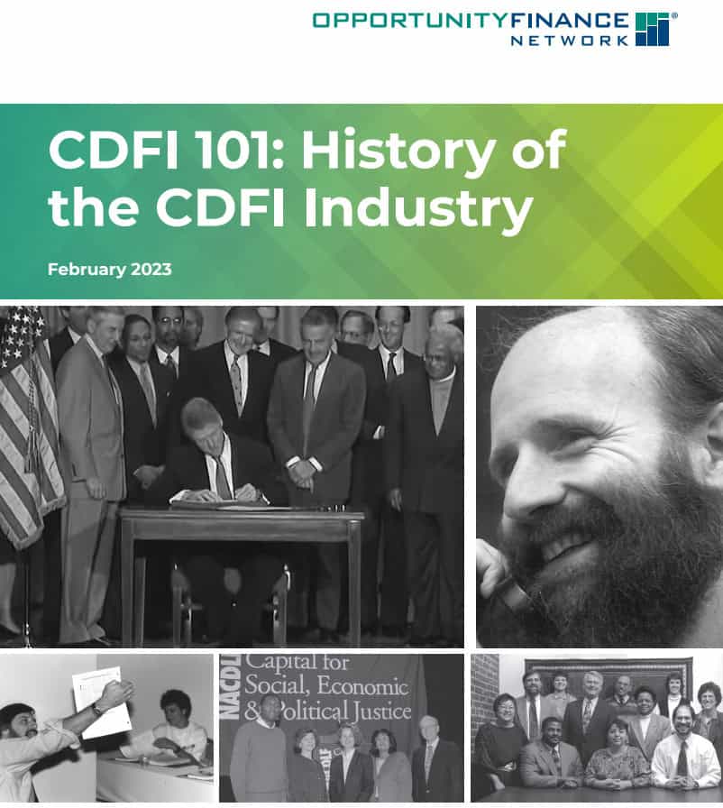 Group of people at a signing event for the CDFI industry history report.
